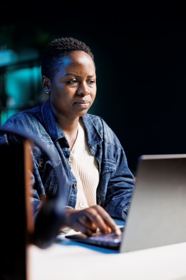 Picture of five (5) girls interacting with an iPad
