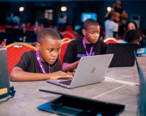 Mother and daughter looking at eachother and smiling