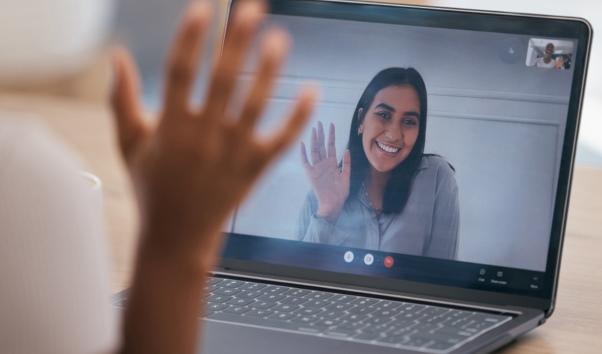 Picture of five (5) girls interacting with an iPad