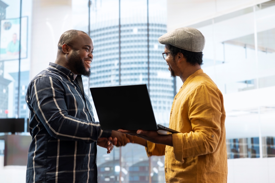 Picture of five (5) girls interacting with an iPad
