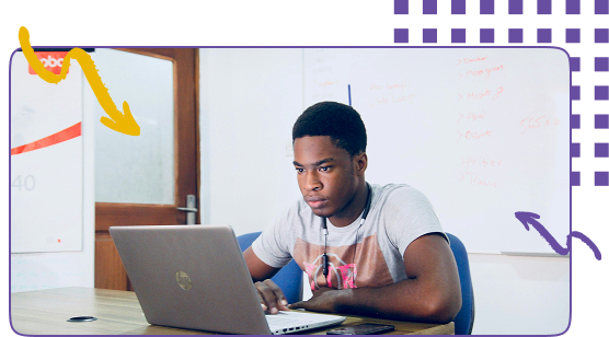 Two adults working on separate laptops
